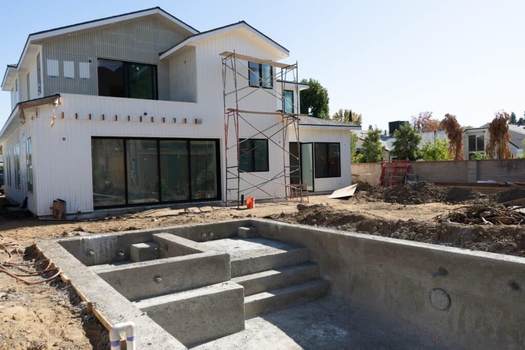Two-story home and pool under construction — Greenbush project, Sherman Oaks